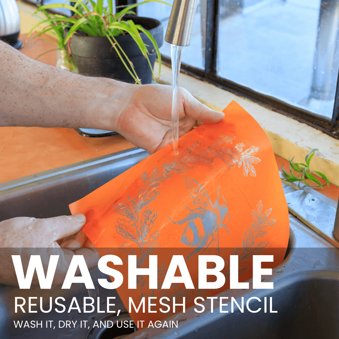 Washable mesh stencil being rinsed clean under running water so it can be reused