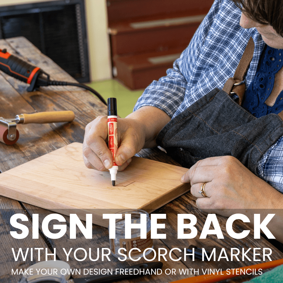Signing the back of a finished cutting board with a Scorch Marker